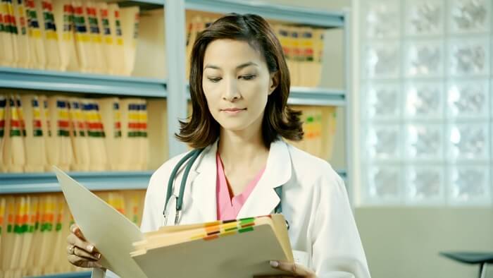 female medicale assistant reading