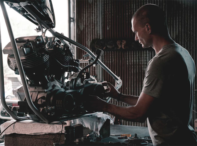 Mechanical Engineer holding engines